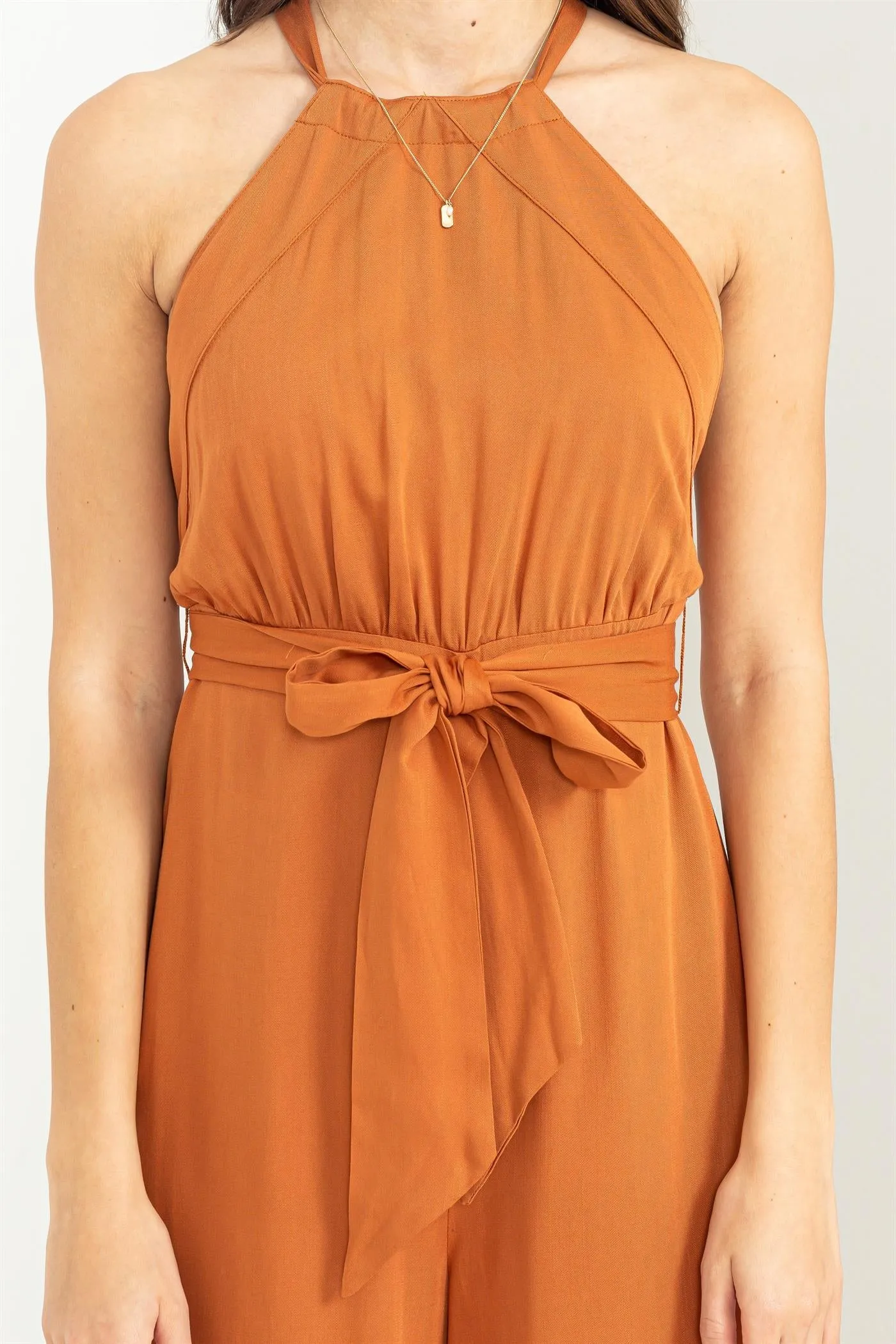 BELTED SLEEVELESS HALTER JUMPSUIT