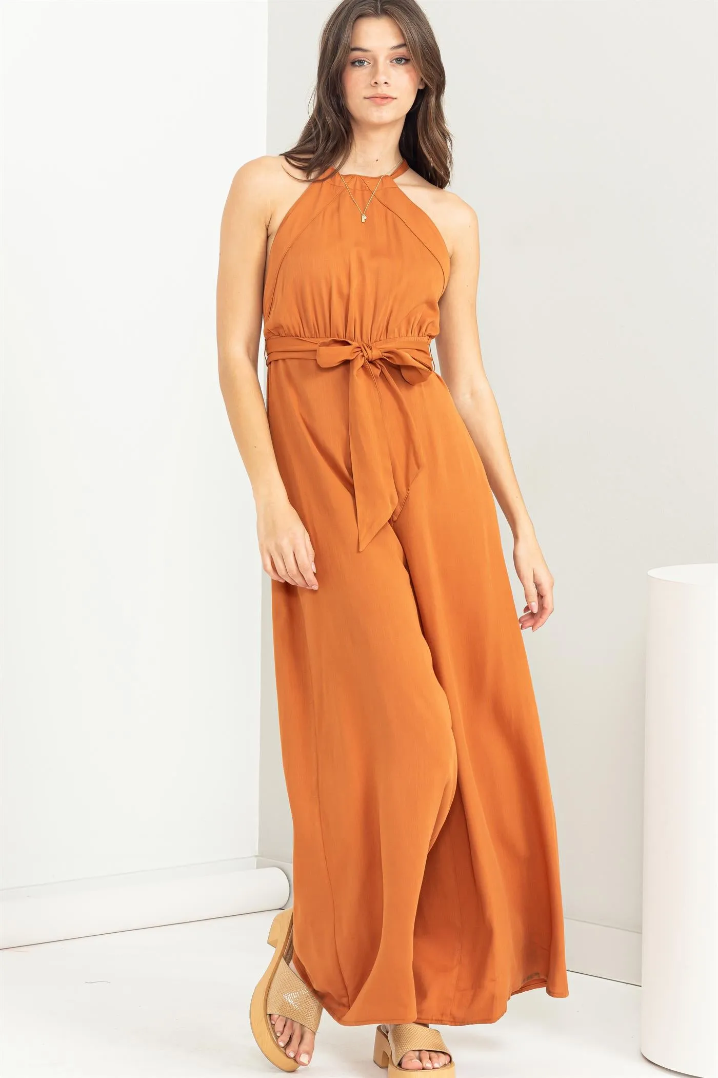 BELTED SLEEVELESS HALTER JUMPSUIT